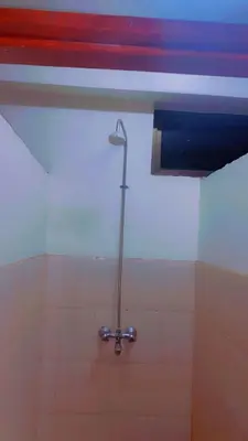a shower in a bathroom with a shower head at Kyanga Hostel in Arusha