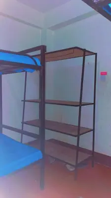 a room with two bunk beds in a room at Kyanga Hostel in Arusha