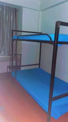 a couple of bunk beds in a room at Kyanga Hostel in Arusha
