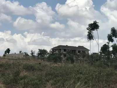 a house on a hill in a field at Lufo Heritage Farm - Octavian Mshiu Residence in Uru