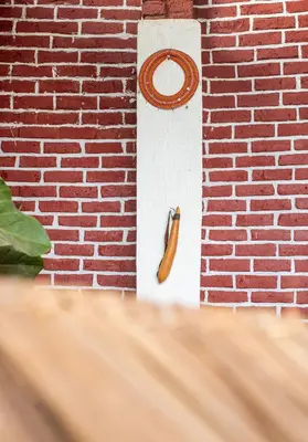 a hot dog sticking out of a brick wall at Ukarimu Hosts in Arusha