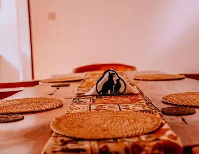 a wooden table topped with waffles with a witch sign on it at Avana Home in Arusha