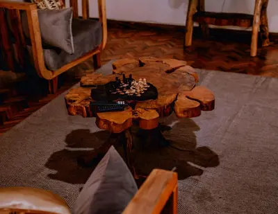 a wooden table with a chess board on top at Avana Home in Arusha