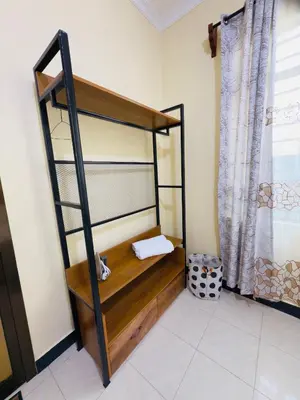 a bunk bed in a room with a window at Fatoosh Nest in Arusha