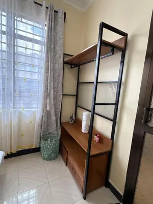 a room with a bunk bed and a shelf at Fatoosh Nest in Arusha