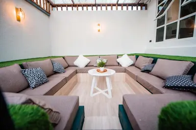 a living room with a couch and a table at Heaven Hill Apartments - Arusha in Arusha