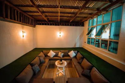 a room with a couch and a table in it at Heaven Hill Apartments - Arusha in Arusha