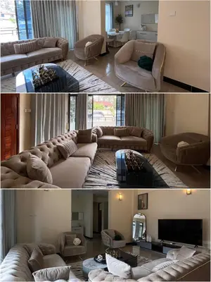 two pictures of a living room with a couch and a living room with a tv at QD Apartment in Arusha