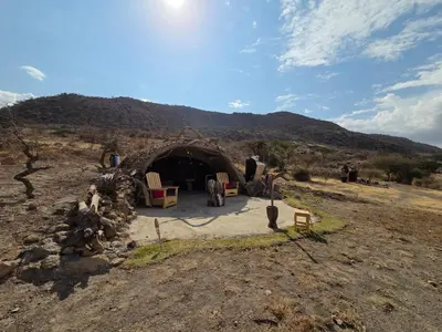 a building in the middle of a field at Maasai Sacred Site - Africa Amini Life in Ngare Nanyuki