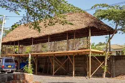 a large hut with a thatched roof at Kilimanjaro Kwetu Homestay in Moshi