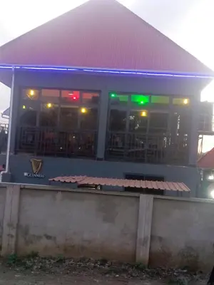 a fast food restaurant with lights in the windows at Old Moshi Park in Arusha