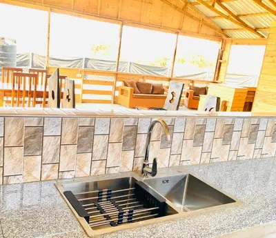 a kitchen with a sink in a counter top at Twende Home lodge in Arusha