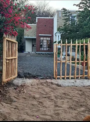 a wooden fence in front of a house at Pumzika hill homes in Arusha