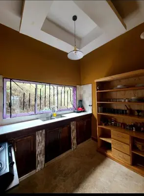 a large kitchen with a sink and a window at Pumzika hill homes in Arusha
