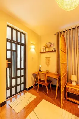 a room with a desk and a table with a surfboard at Serene and Amara By Tadre House's in Arusha