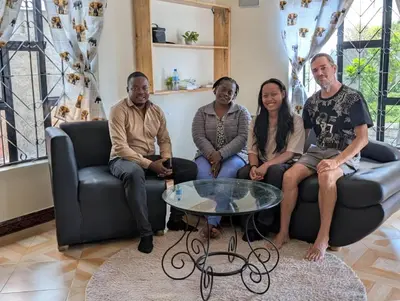 a group of people sitting on a couch at Shavia Home in Arusha