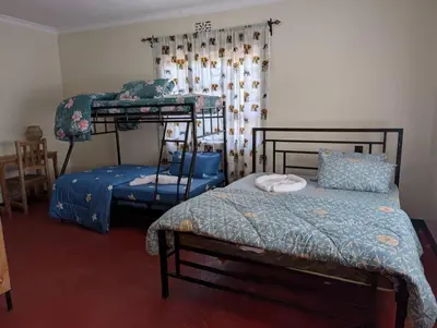 a bedroom with two bunk beds in a room at Shavia Home in Arusha