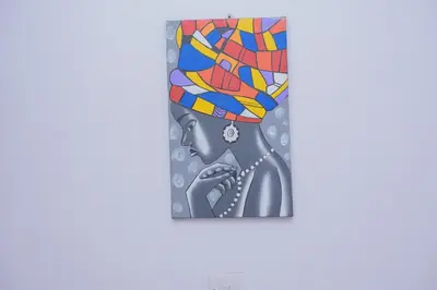 a painting of a woman wearing a turban at Sonia homes shared in Arusha