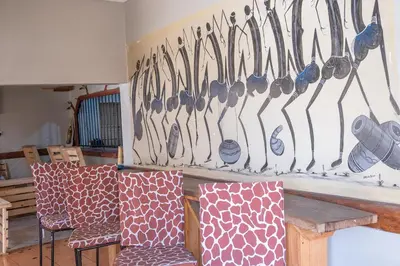 a bunch of utensils hanging on a wall at Seuri Bar and Guesthouse in Arusha