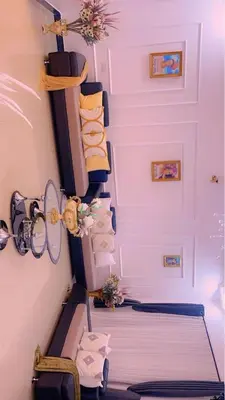 a room with a staircase with towels and a bed at Mama Evaline Family Home in Boma la Ngombe