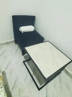 a black chair with a paper roll on the wall at Ma lo Lounge n Lodge