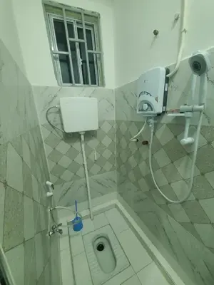 a bathroom with a shower with a toilet in it at Ma lo Lounge n Lodge