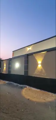a building with lights on the side of it at Ma lo Lounge n Lodge