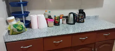 a counter with paper towels and other items on it at Friendly House in Arusha