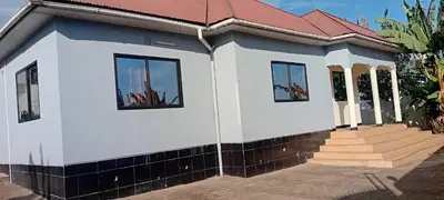 a house with a red roof at Friendly House in Arusha