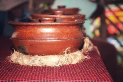a group of brown vases sitting on a red table at Materuni Home Stay in Uru East