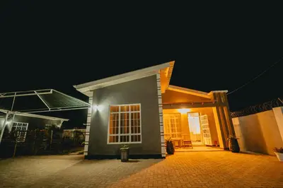 a house at night with the lights on at FREEDOM homes in Arusha