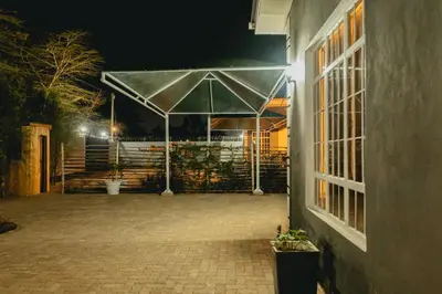 a pavilion with a tent at night at FREEDOM homes in Arusha