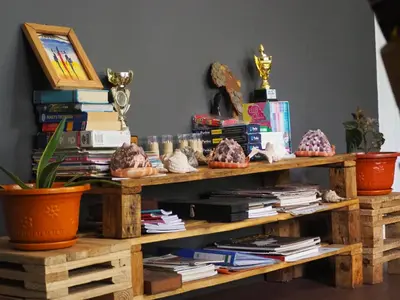 a wooden table with books on top at freedom house in Msaranga