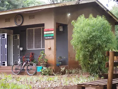 a bike parked in front of a house at freedom house in Msaranga