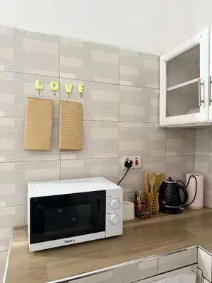 a microwave oven sitting on a counter in a kitchen at Haven Retreat in Arusha
