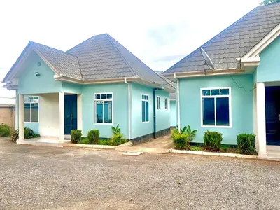 a house with blue paint on it at The Black Mamba in Arusha