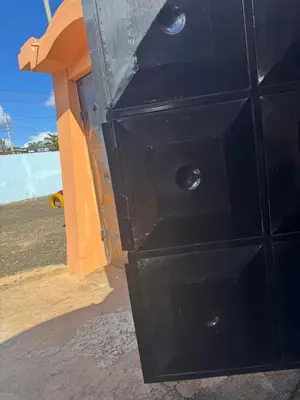 a black dresser with four drawers in front of a building at Njiro Rented 3 Bedroom House in Themi