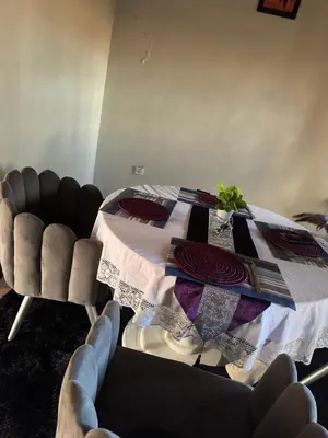 a dining room with a table and two chairs at Njiro Rented 3 Bedroom House in Themi