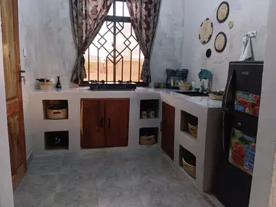 a kitchen with a sink and a window at Nyumbani House in Mto wa Mbu