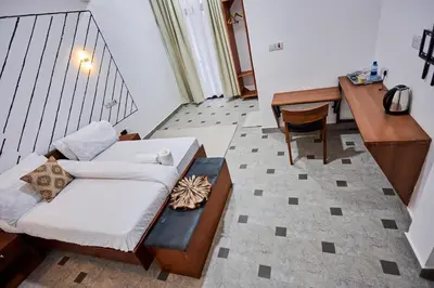 a living room with a couch and a table at Njiro Luxury in Arusha