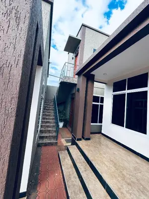 a view from the outside of a house with a staircase at Cj VILLA in Karatu