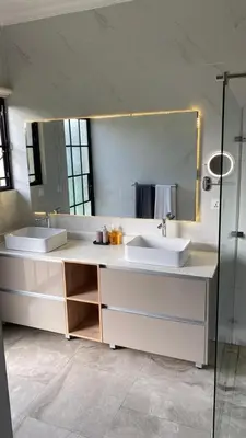 a bathroom with two sinks and a large mirror at Asama House in Usa