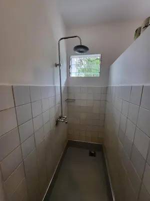 a bathroom with a shower with a window at House, towncenter, near to all good restaurants, in Arusha