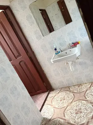 an overhead view of a bathroom with a sink and mirror at At Chilala's in Arusha