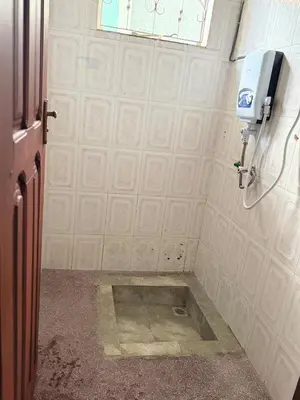 a bathroom with a sink in the middle of the wall at At Chilala's in Arusha