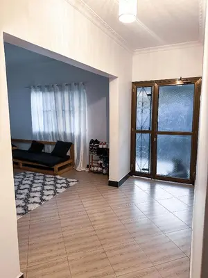 a living room with a couch and a window at njiro one in Arusha