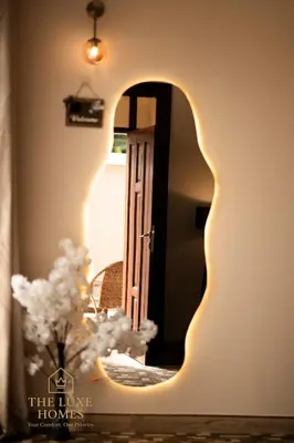 a room with a door and a vase with flowers at The Luxe Homes 3BR Luxury Stay in Tuvaila