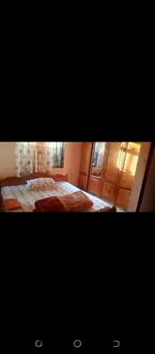 a bedroom with a large bed in a room at Latricia Home Stay in Moshi