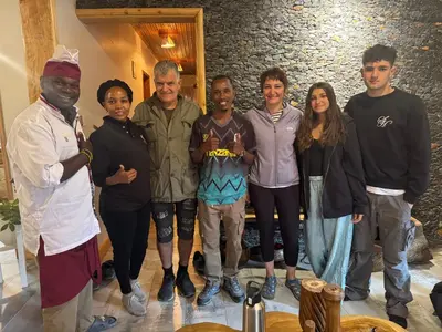 a group of people posing for a picture at Kienyeji Wooden Rest Arusha in Nkoanrua