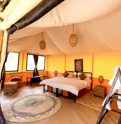 a bedroom with a bed in a tent at Ndutu Bush Camp in Endulen